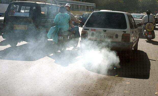 Pollution: An old car releases excess smoke in Delhi.